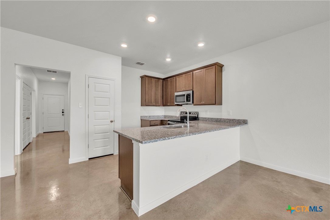 3901 Sugar Hackberry Trail Killeen, TX 76542 - Photo 5 of 16 a kitchen with sink and cabinets