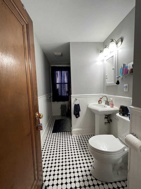 39 Woodford Street, Unit 2 Worcester, MA 01604 - Photo 12 of 20 a bathroom with a toilet a sink and a shower