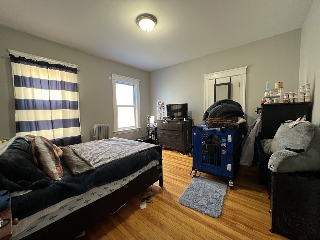 39 Woodford Street, Unit 2 Worcester, MA 01604 - Photo 14 of 20 a bedroom with bed and window