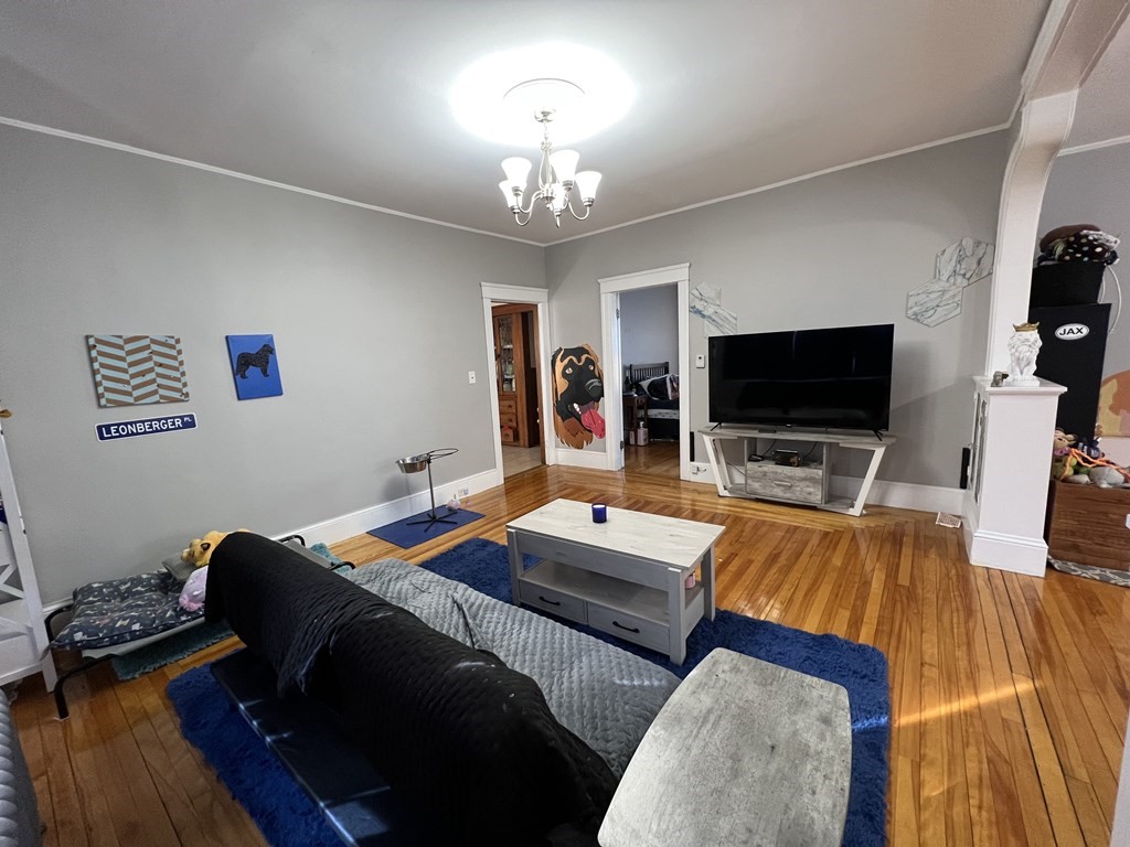 39 Woodford Street, Unit 2 Worcester, MA 01604 - Photo 2 of 20 a living room with furniture and a flat screen tv