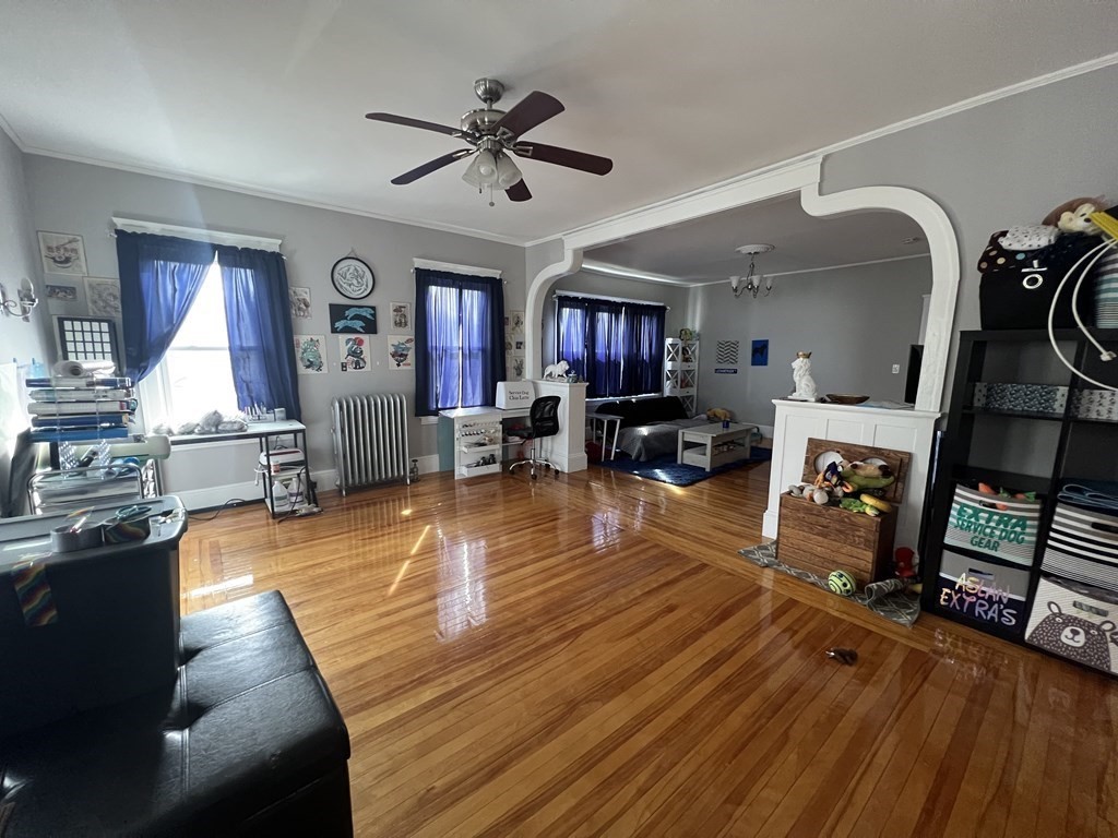 39 Woodford Street, Unit 2 Worcester, MA 01604 - Photo 3 of 20 a living room with fireplace furniture and a wooden floor