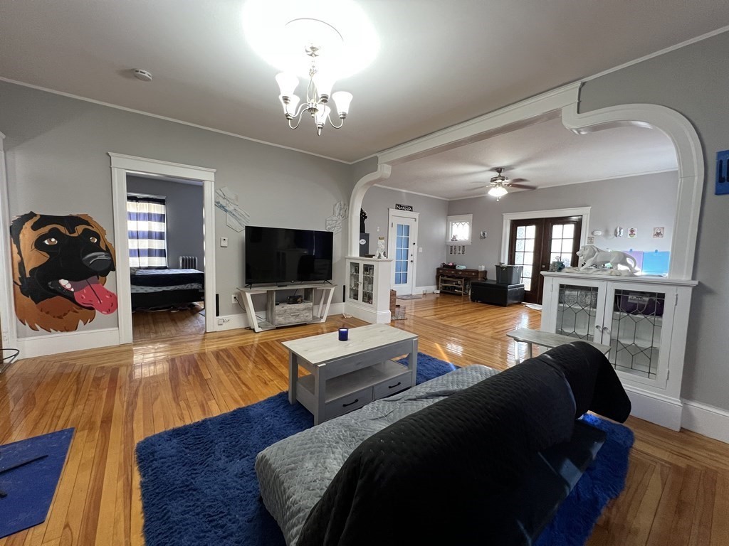 39 Woodford Street, Unit 2 Worcester, MA 01604 - Photo 6 of 20 a living room with furniture and a flat screen tv
