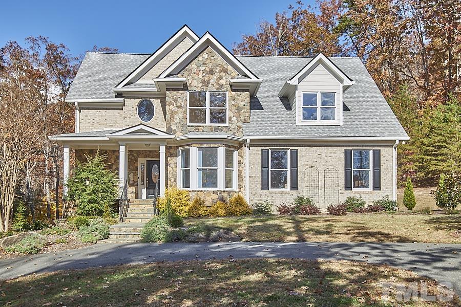 243 Rassie Crabtree Road Rougemont, NC 27572 - Photo 2 of 30 a front view of a house with a yard