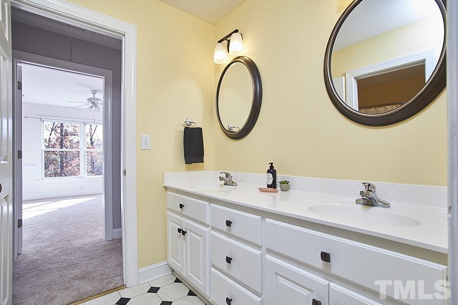 243 Rassie Crabtree Road Rougemont, NC 27572 - Photo 23 of 30 a bathroom with a sink and a mirror