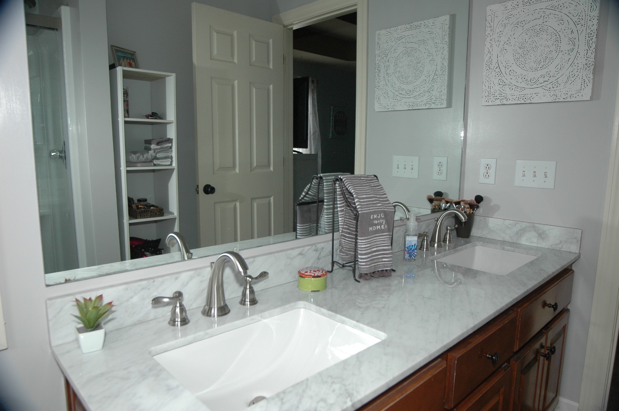 4607 Washington Road Greenbrier, TN 37073 - Photo 14 of 40 a bathroom with double vanity sinks and a mirror