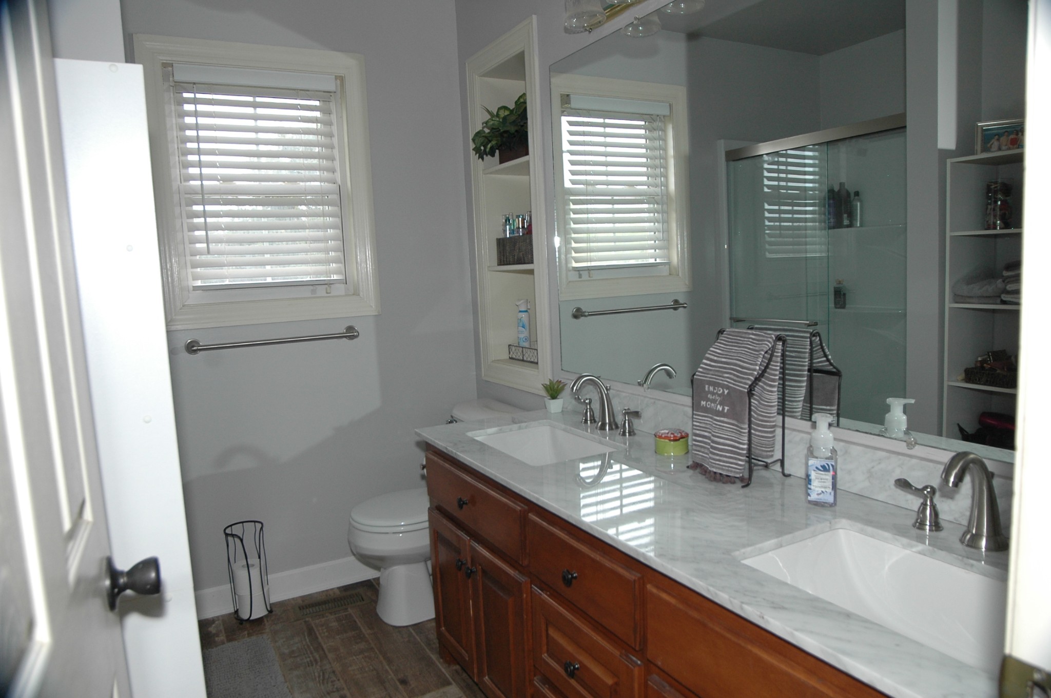 4607 Washington Road Greenbrier, TN 37073 - Photo 16 of 40 a bathroom with a granite countertop sink toilet a mirror and shower