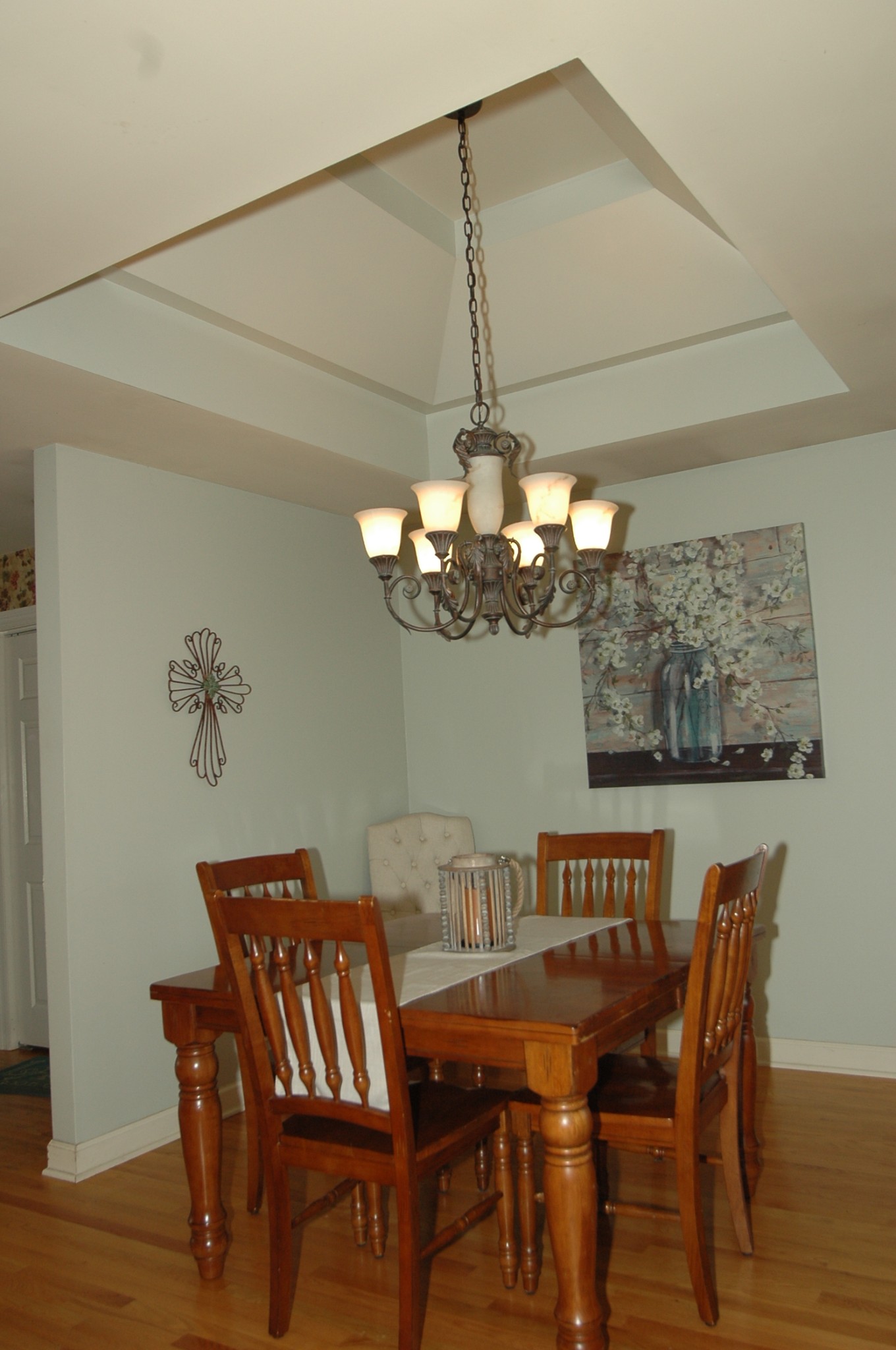 4607 Washington Road Greenbrier, TN 37073 - Photo 19 of 40 a view of a dining room with furniture a chandelier and wooden floor