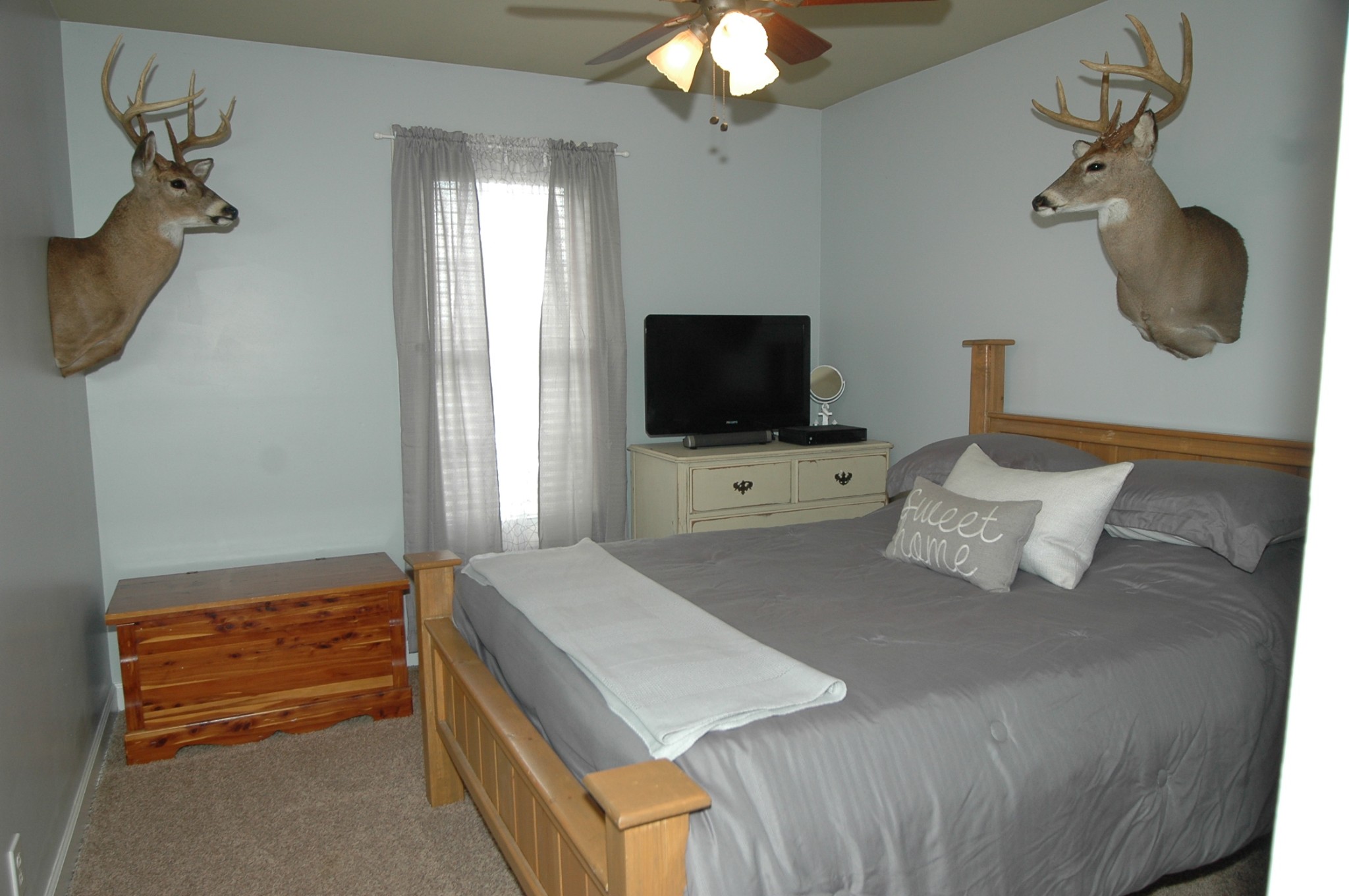 4607 Washington Road Greenbrier, TN 37073 - Photo 20 of 40 a bedroom with a bed and a flat screen tv