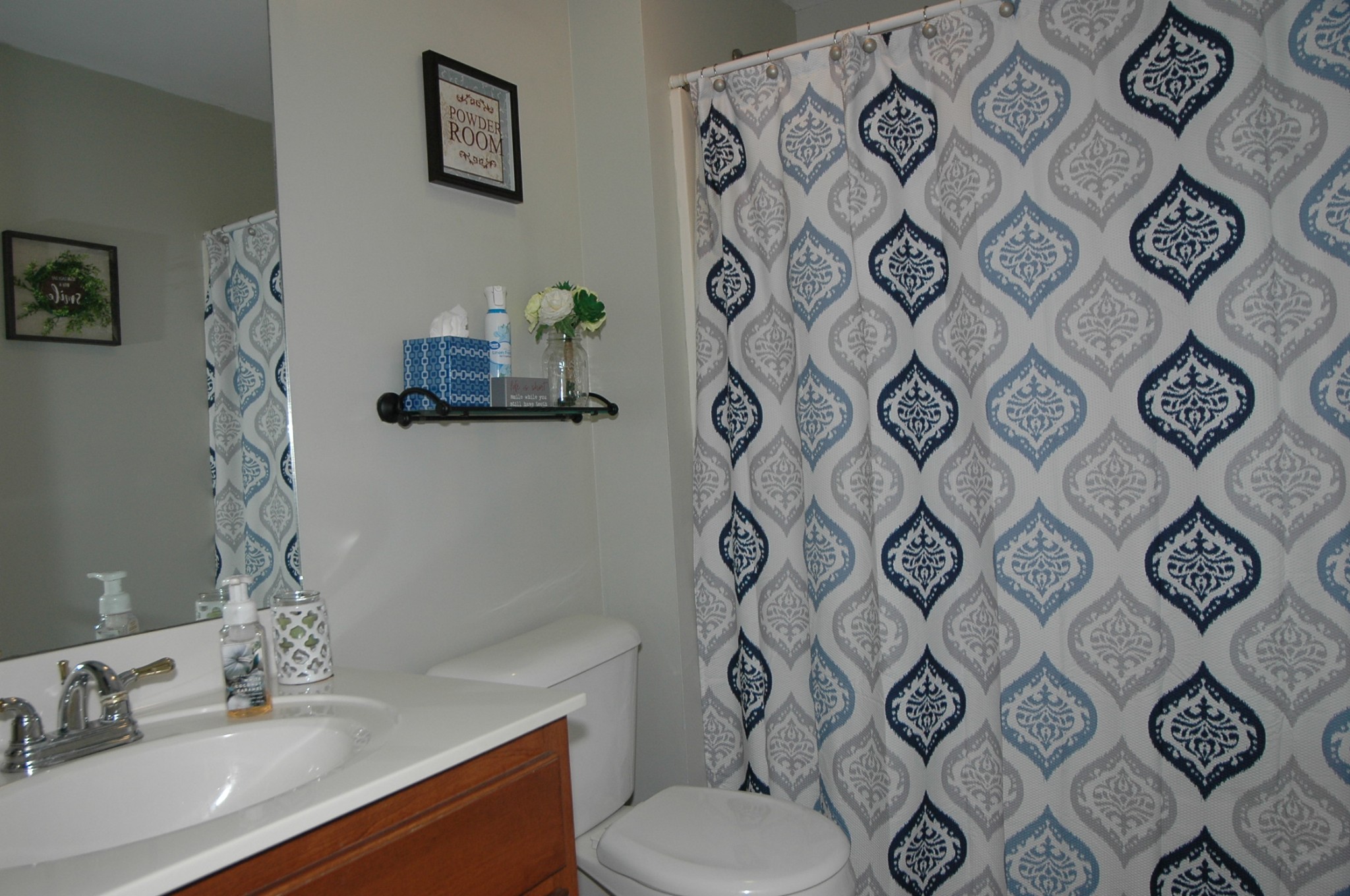 4607 Washington Road Greenbrier, TN 37073 - Photo 23 of 40 a bathroom with a toilet sink and mirror