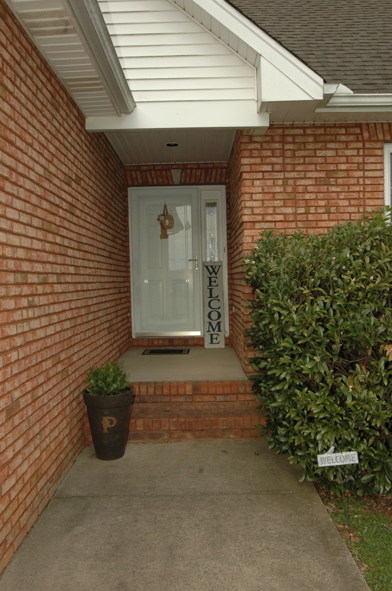 4607 Washington Road Greenbrier, TN 37073 - Photo 29 of 40 a potted plant sitting in front of a house