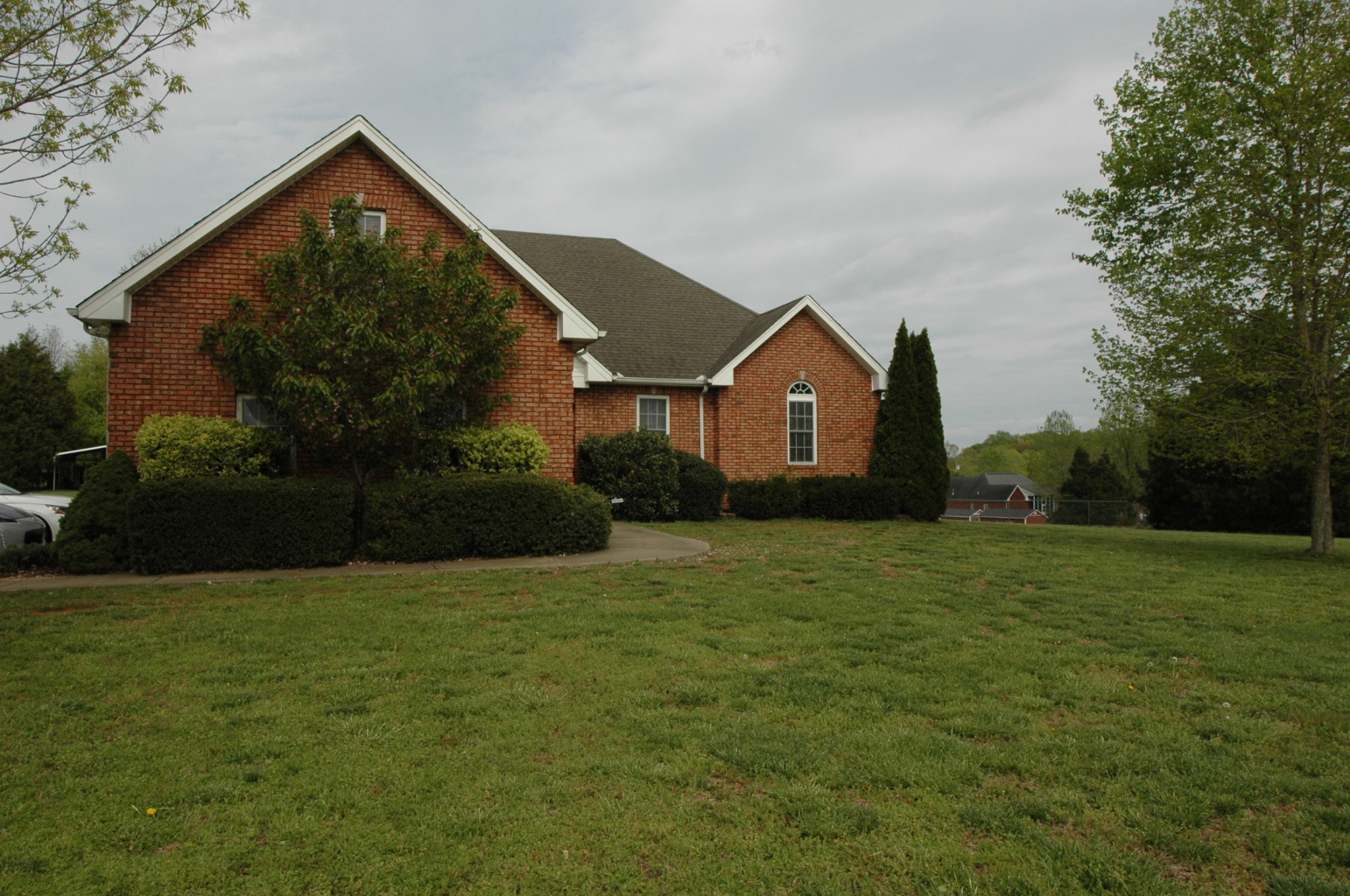 4607 Washington Road Greenbrier, TN 37073 - Photo 30 of 40 a front view of a house with a garden