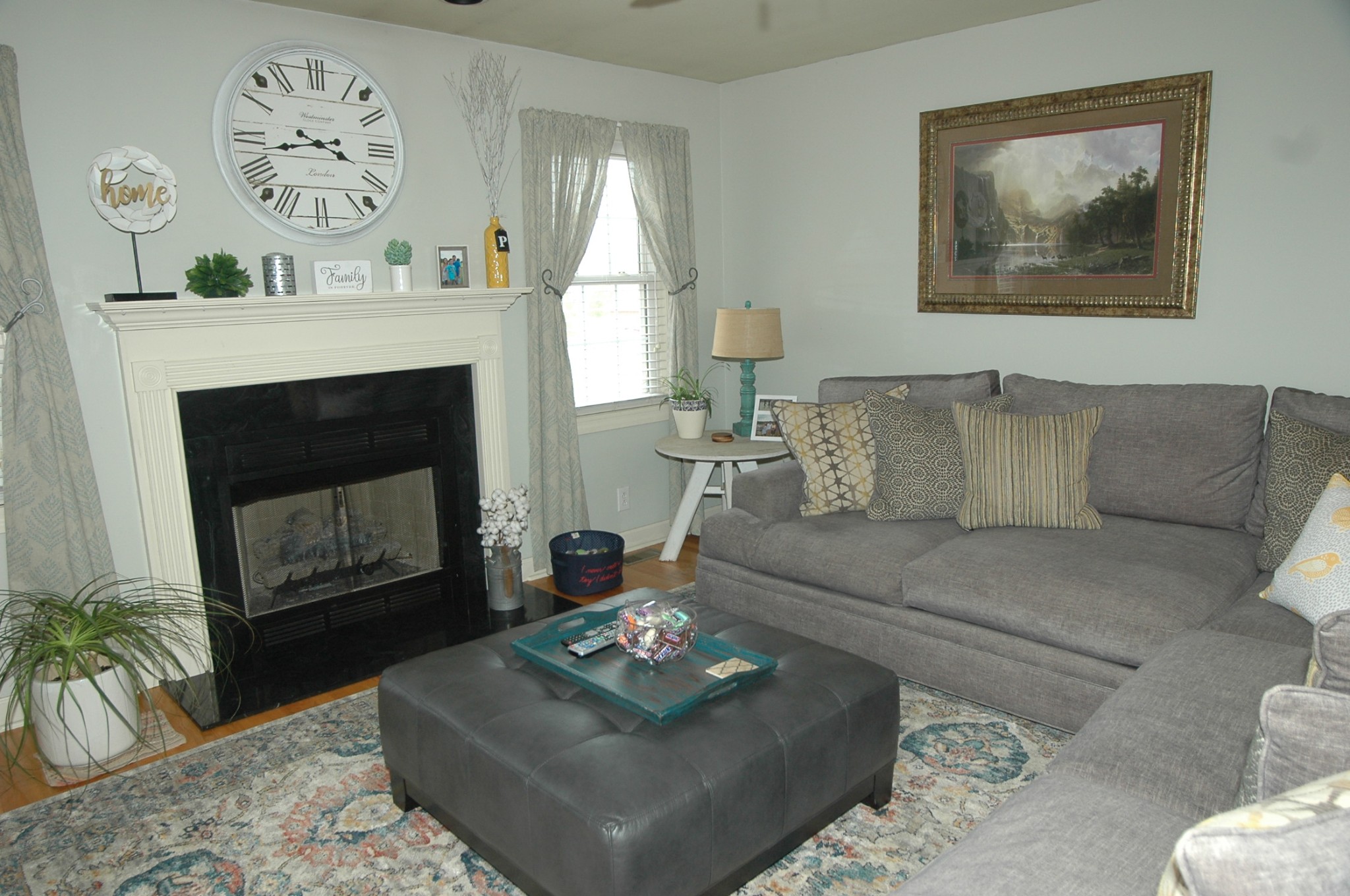4607 Washington Road Greenbrier, TN 37073 - Photo 3 of 40 a living room with furniture a fireplace and paintings on wall