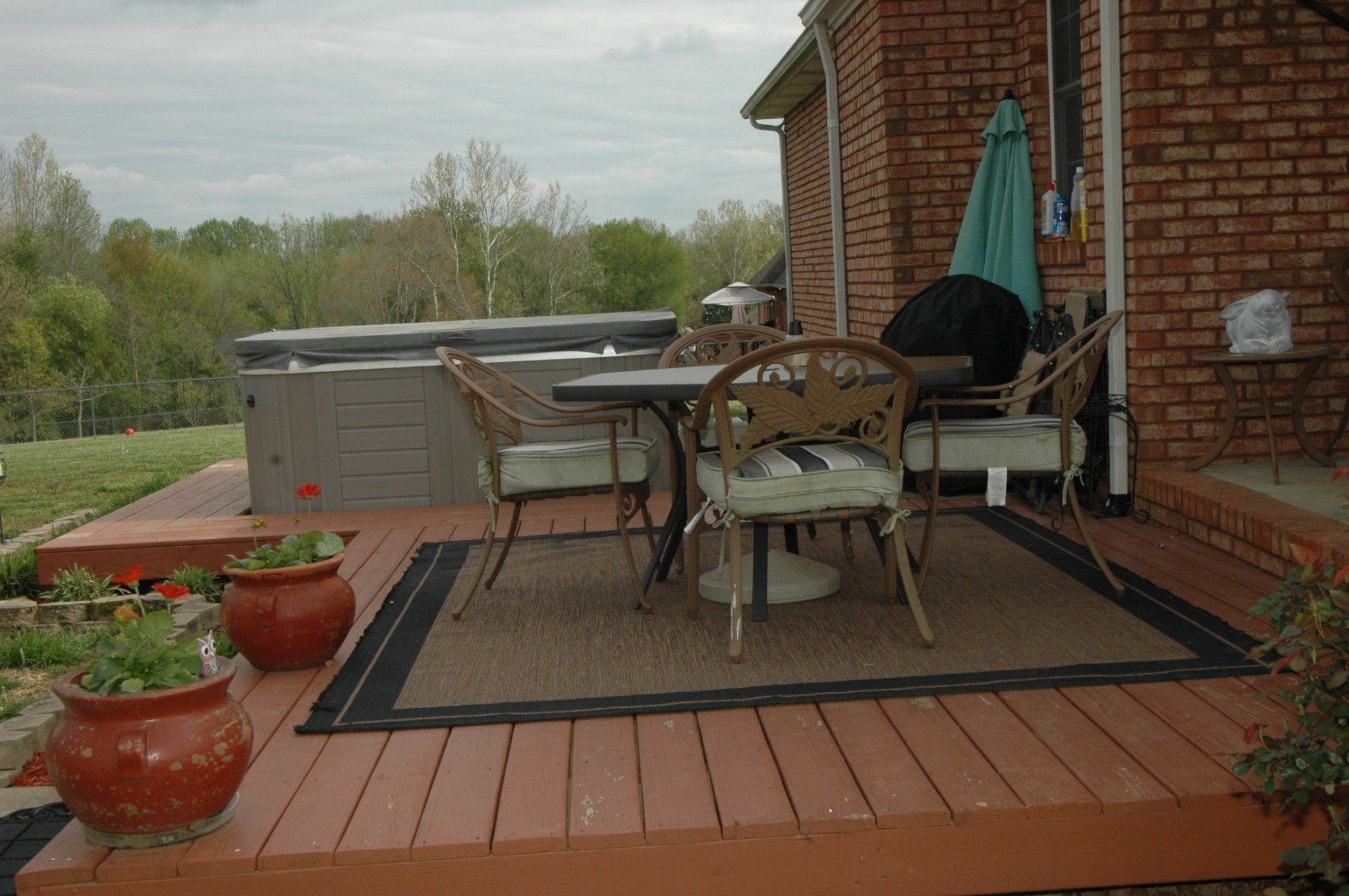 4607 Washington Road Greenbrier, TN 37073 - Photo 33 of 40 a view of a patio with table and chairs and potted plants