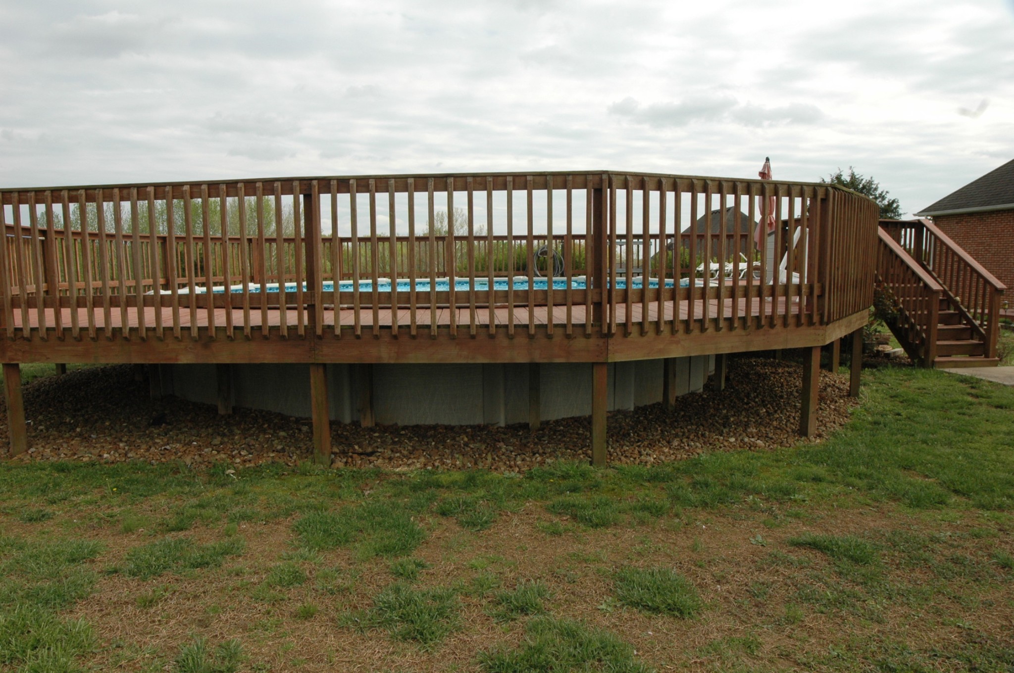4607 Washington Road Greenbrier, TN 37073 - Photo 36 of 40 a view of a wooden deck and a yard