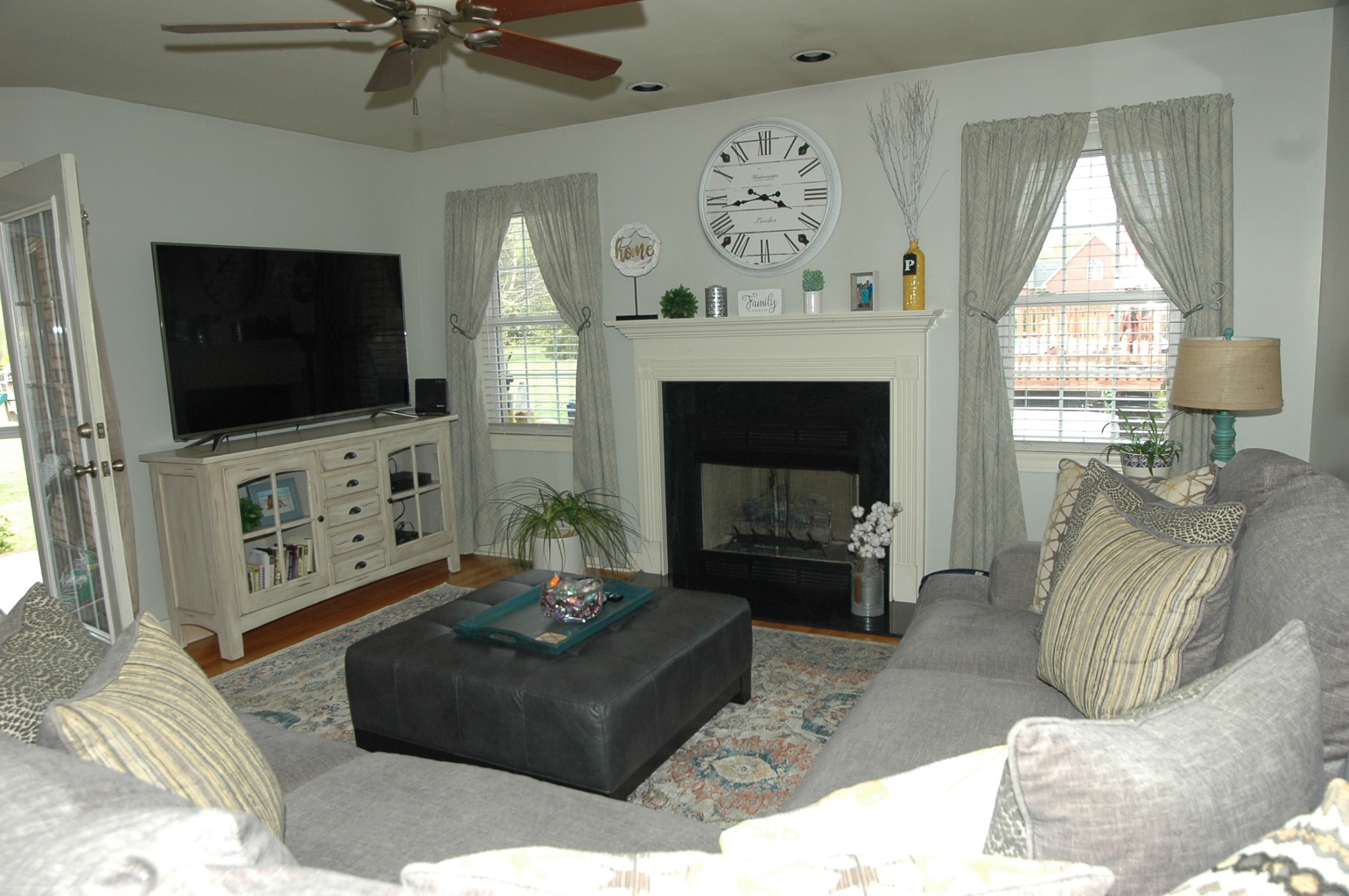 4607 Washington Road Greenbrier, TN 37073 - Photo 4 of 40 a living room with furniture a flat screen tv and a fireplace