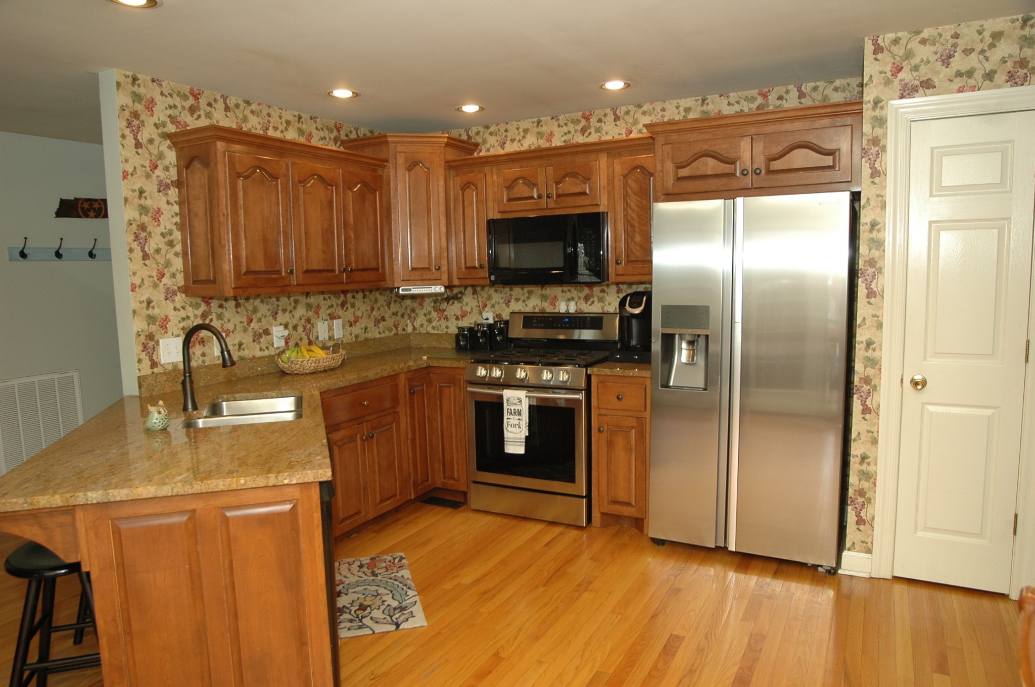 4607 Washington Road Greenbrier, TN 37073 - Photo 6 of 40 a kitchen with stainless steel appliances granite countertop a refrigerator a stove and a sink