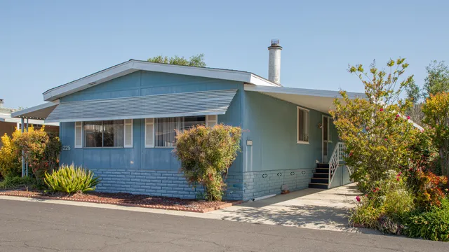 front view of a house with potted plants
