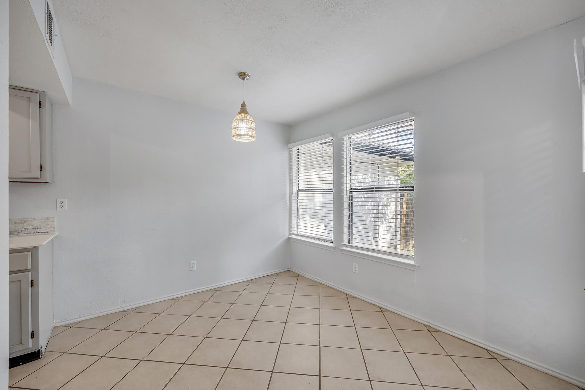 8102 Tuscarora Trail, Unit A Austin, TX 78729 - Photo 11 of 35 a view of an empty room with a window