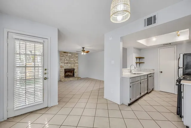 a kitchen with a cabinets and a stove top oven