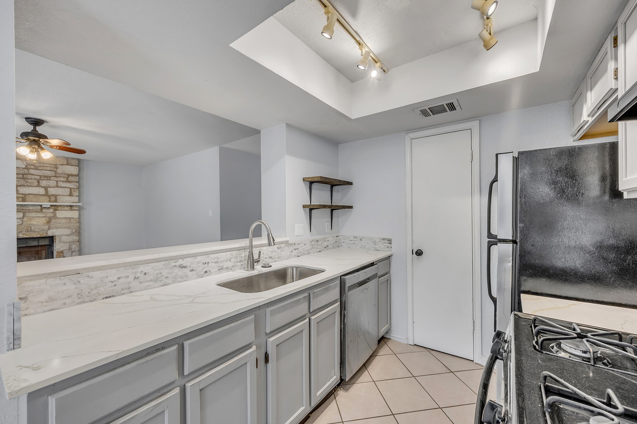 8102 Tuscarora Trail, Unit A Austin, TX 78729 - Photo 14 of 35 a bathroom with a sink and a mirror