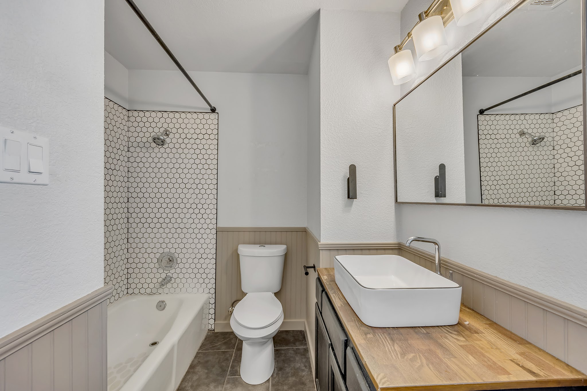 8102 Tuscarora Trail, Unit A Austin, TX 78729 - Photo 25 of 35 a bathroom with a toilet a sink and bathtub