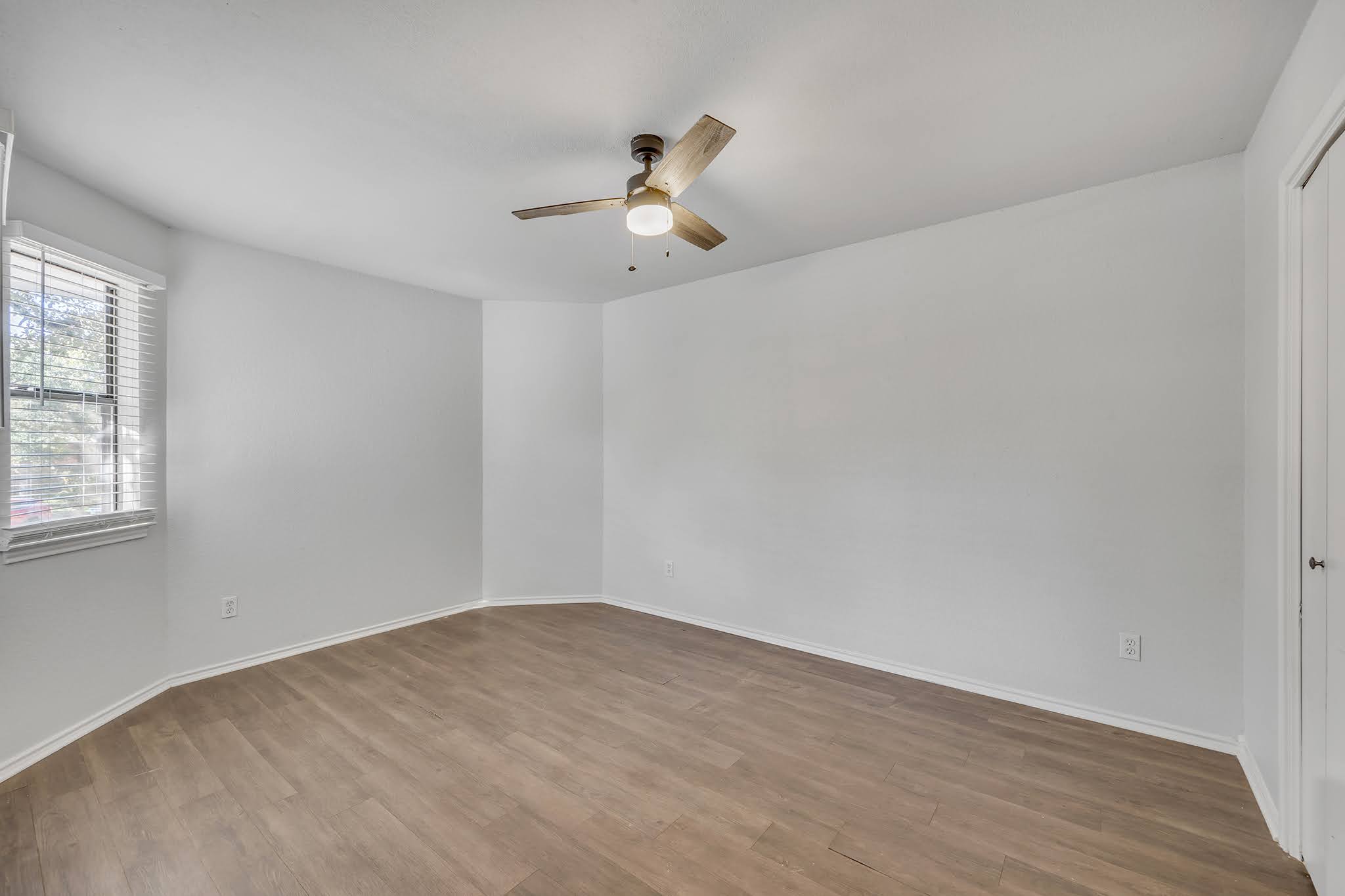 8102 Tuscarora Trail, Unit A Austin, TX 78729 - Photo 26 of 35 wooden floor in an empty room with a window