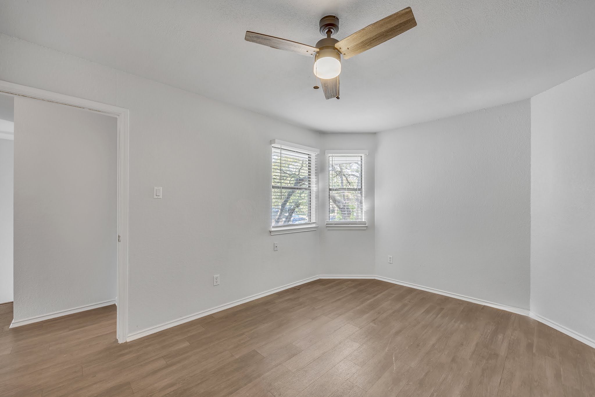 8102 Tuscarora Trail, Unit A Austin, TX 78729 - Photo 27 of 35 wooden floor in an empty room with a window