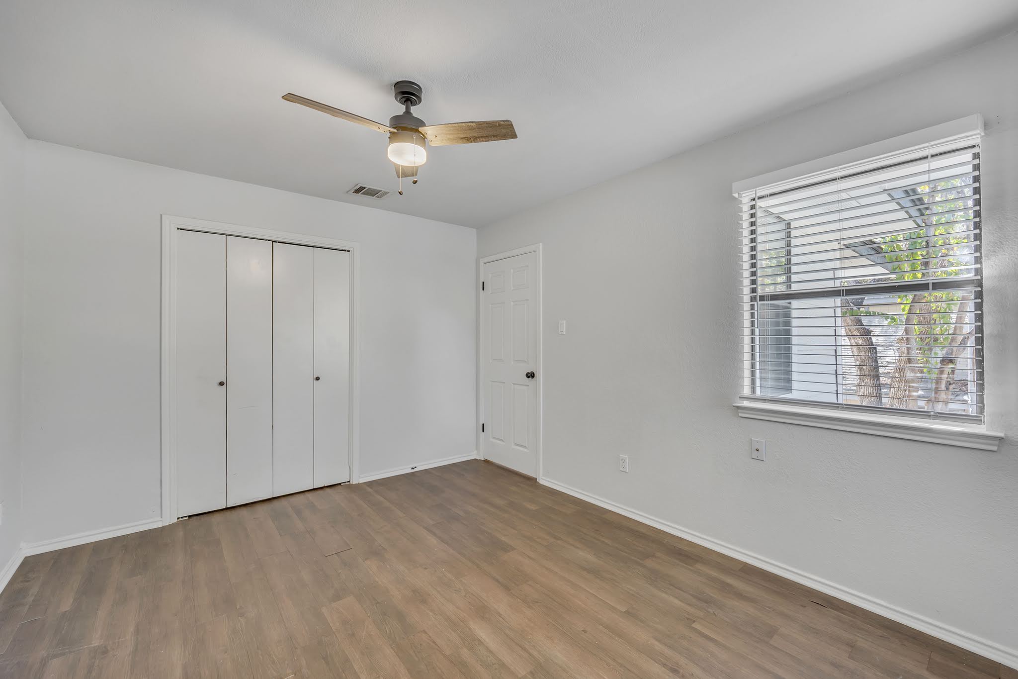 8102 Tuscarora Trail, Unit A Austin, TX 78729 - Photo 28 of 35 a view of an empty room with a window