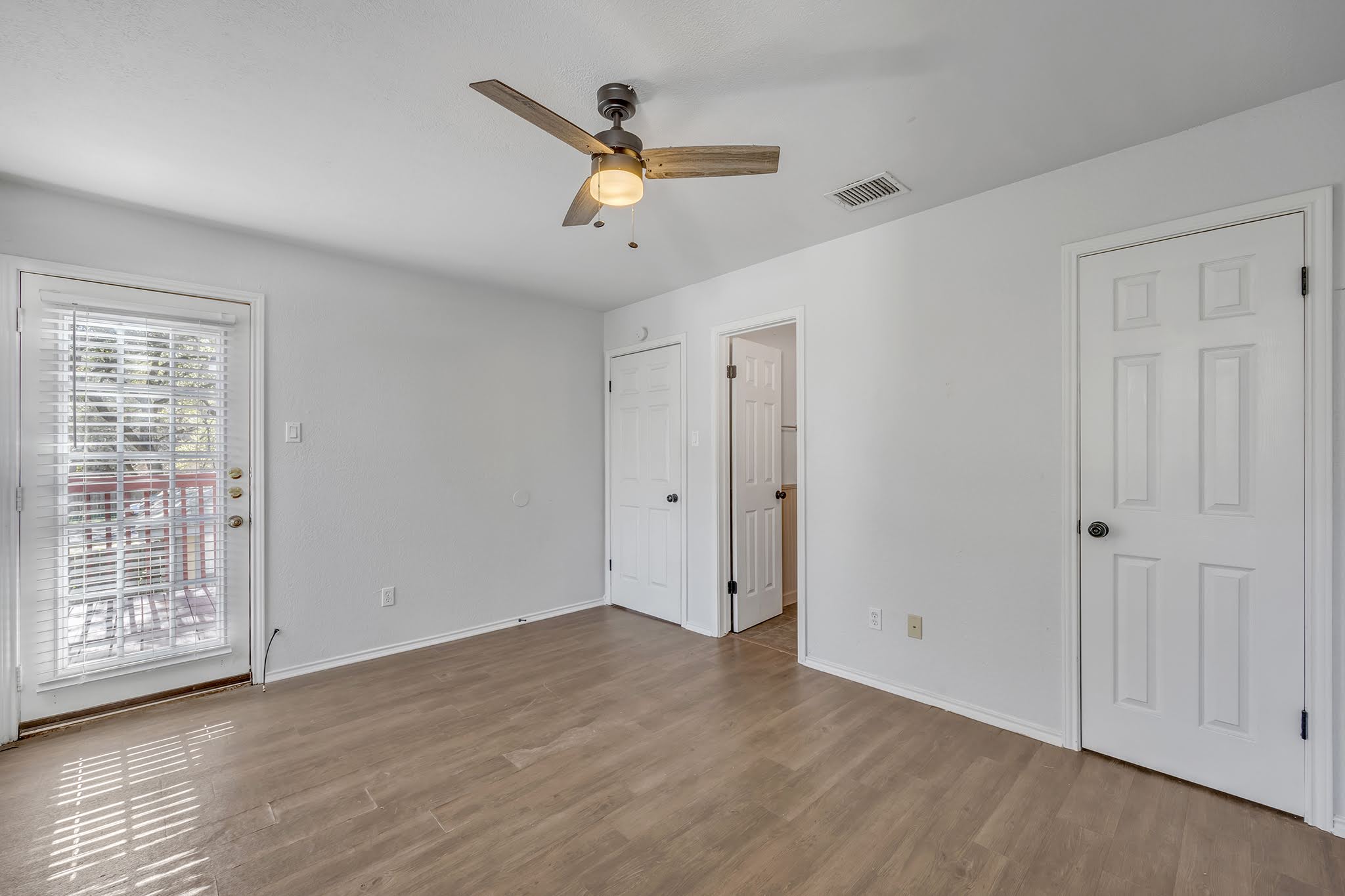 8102 Tuscarora Trail, Unit A Austin, TX 78729 - Photo 31 of 35 a view of a livingroom with a ceiling fan and window