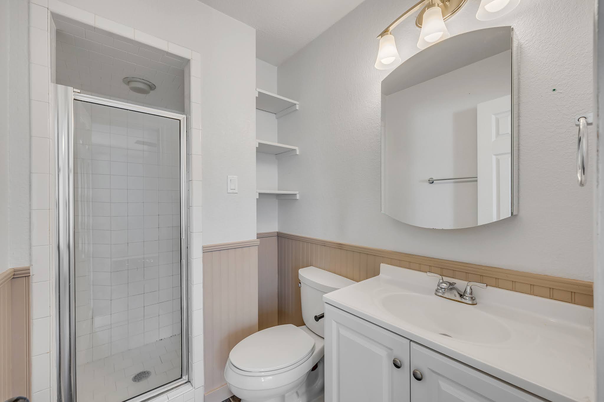 8102 Tuscarora Trail, Unit A Austin, TX 78729 - Photo 32 of 35 a bathroom with a sink a toilet and shower