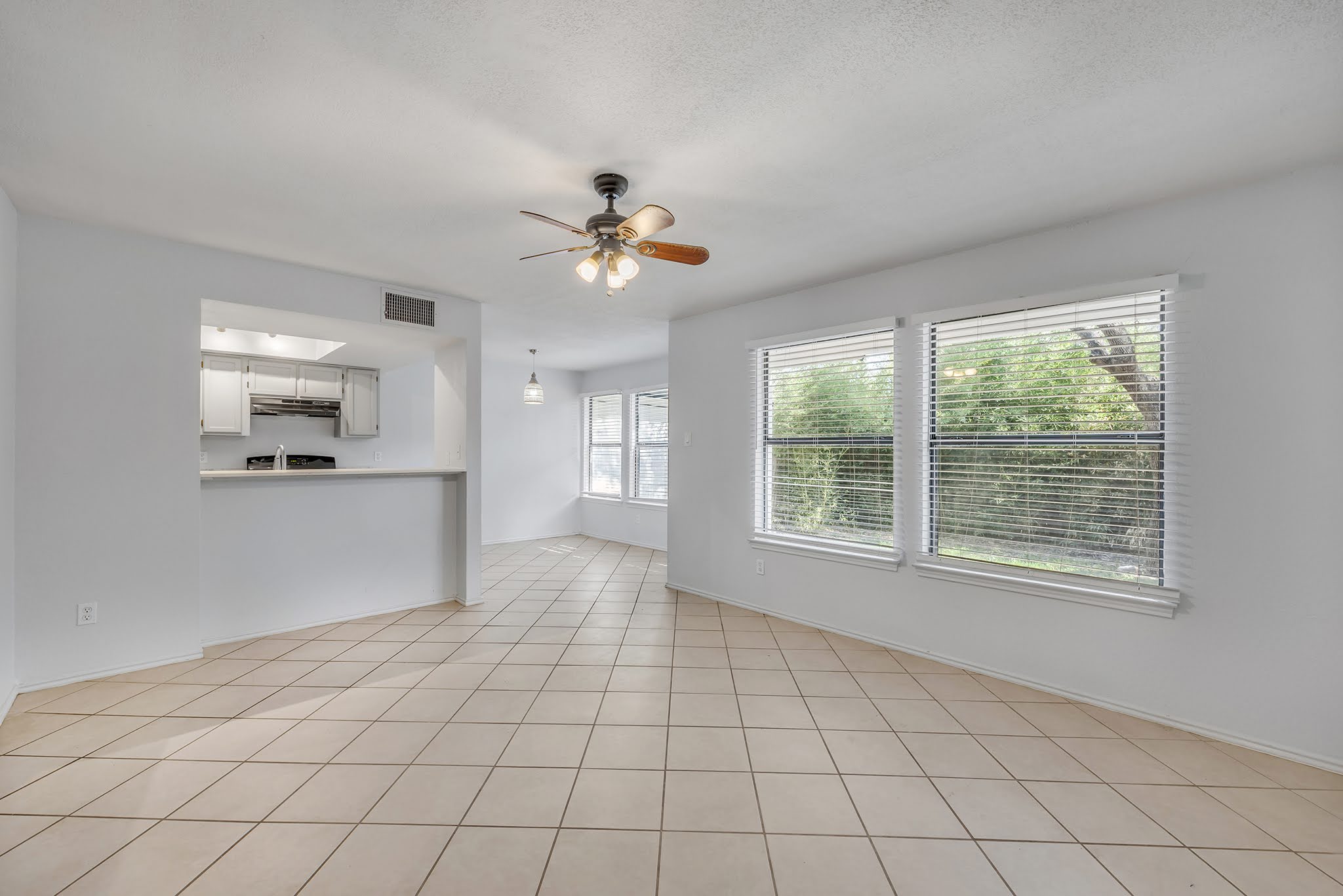 8102 Tuscarora Trail, Unit A Austin, TX 78729 - Photo 7 of 35 a view of an empty room with a window