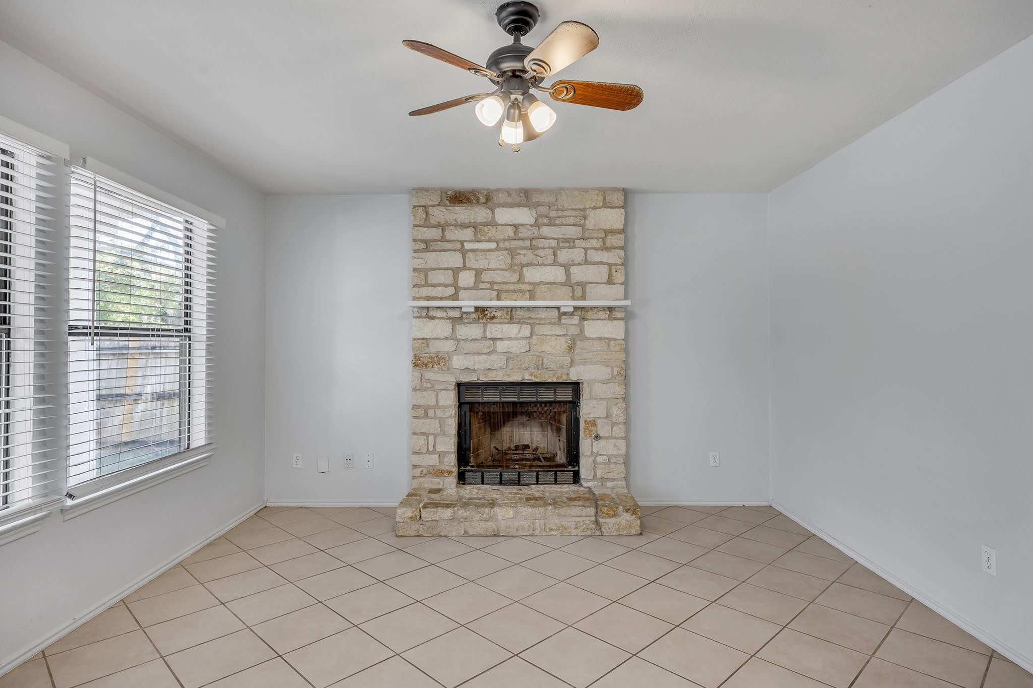 8102 Tuscarora Trail, Unit A Austin, TX 78729 - Photo 10 of 35 a living room with furniture and a fireplace