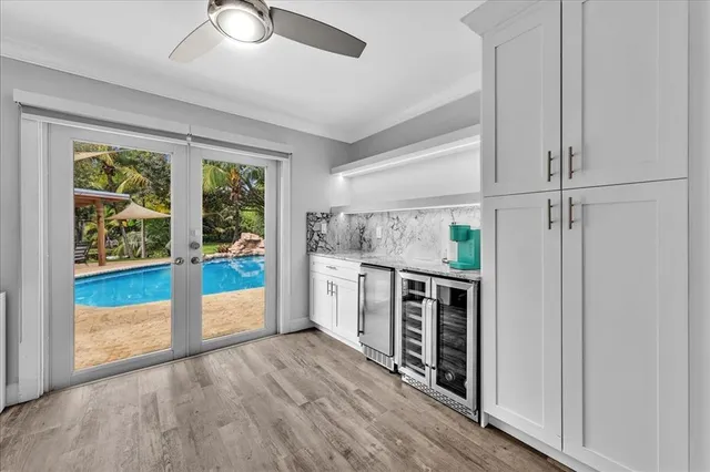 a view of kitchen with furniture and refrigerator
