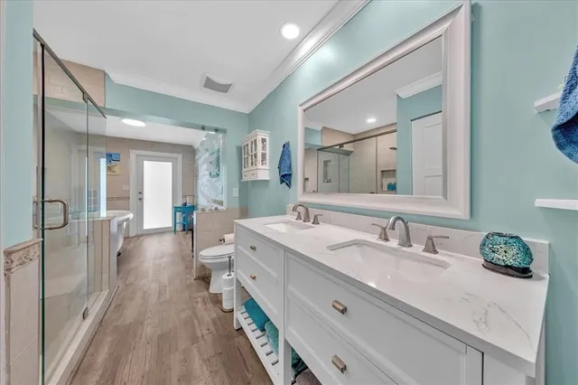 a spacious bathroom with a double vanity sink and a mirror
