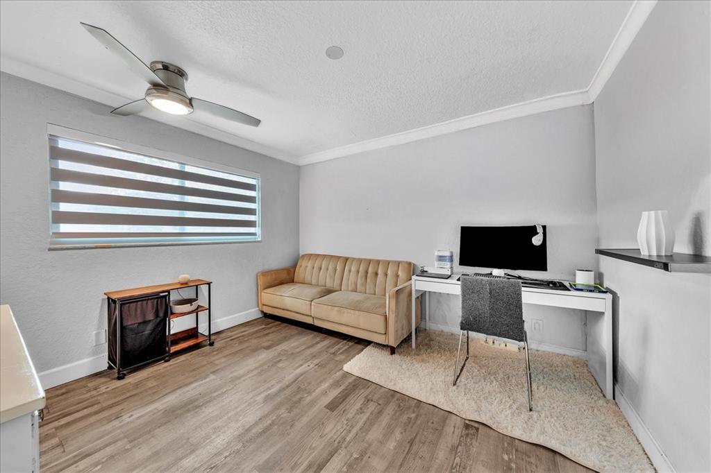 2931 Southwest 108th Way Davie, FL 33328 - Photo 25 of 36 a living room with furniture and a flat screen tv