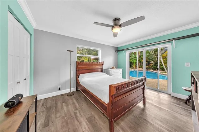 a bed room with a bed and a window