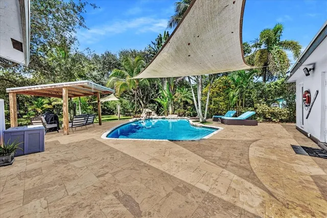 a view of a backyard with a patio