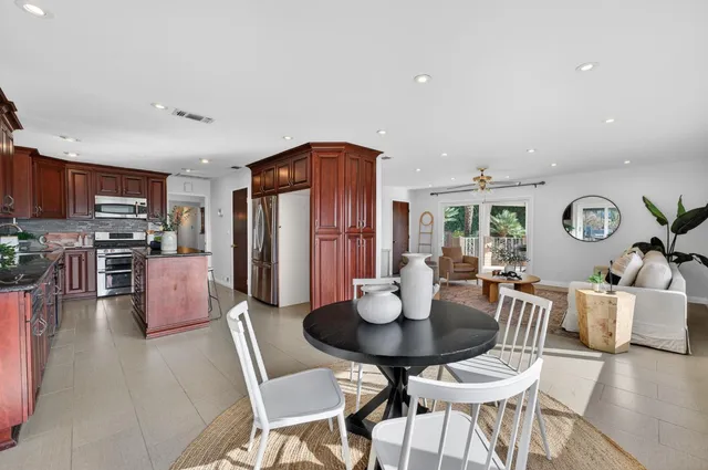 a view of a patio with a table and chairs