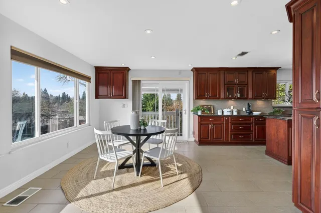 an aerial view of a house with garden space and street view