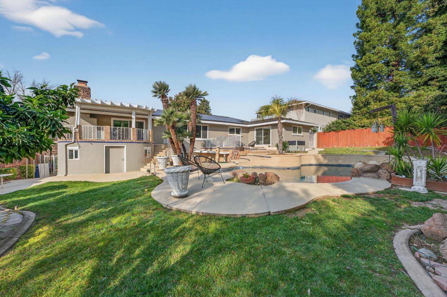 3006 Scenic Heights Way Carmichael, CA 95608 - Photo 48 of 76 a front view of a house with a garden
