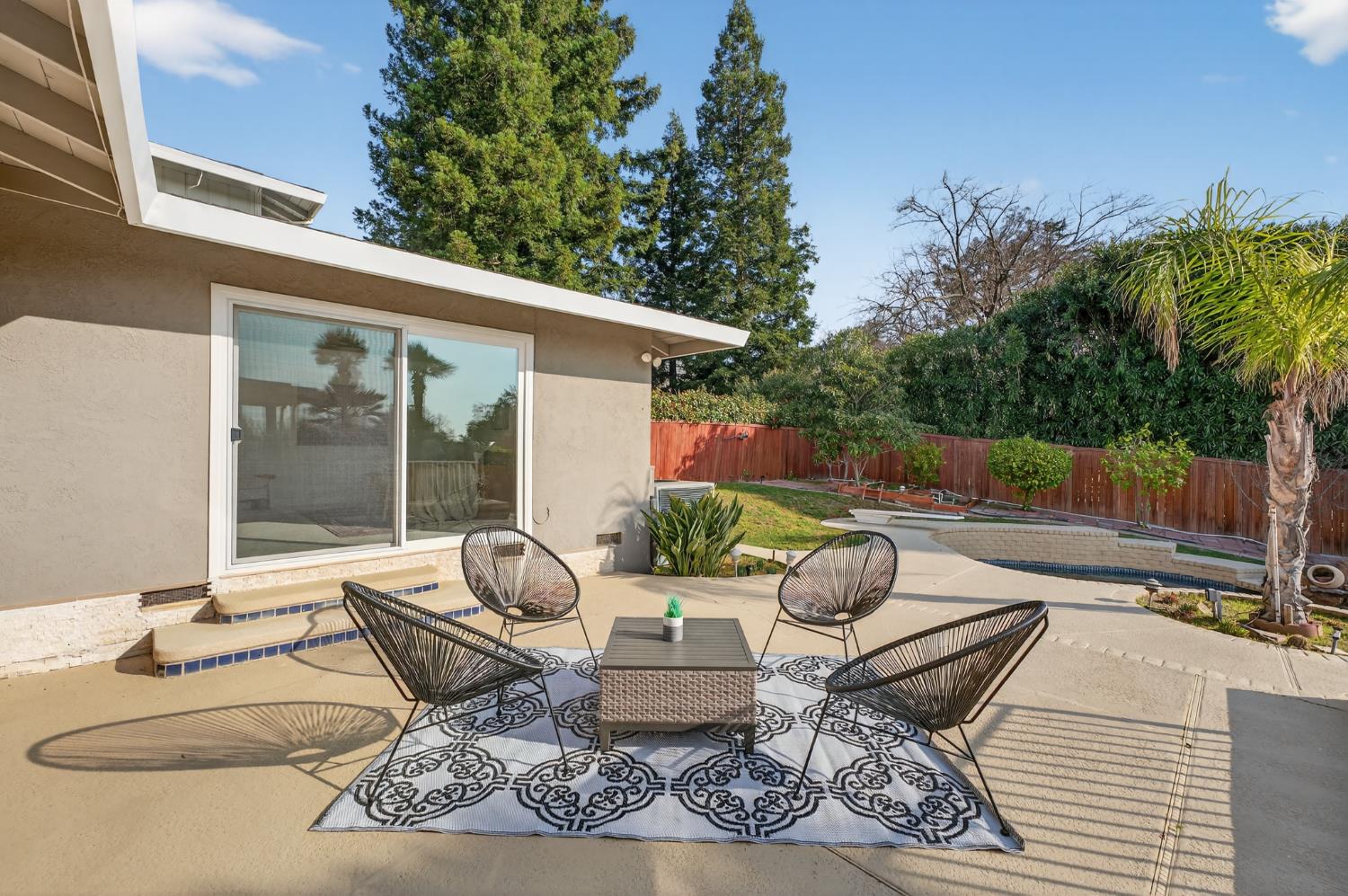 3006 Scenic Heights Way Carmichael, CA 95608 - Photo 60 of 76 a view of a patio with couches table and chairs and potted plants