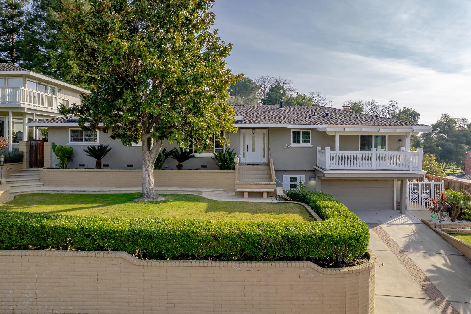 3006 Scenic Heights Way Carmichael, CA 95608 - Photo 7 of 76 a front view of a house with a yard table and chairs