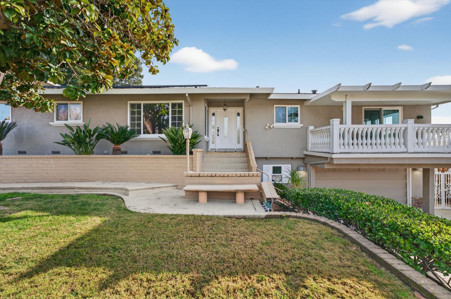 3006 Scenic Heights Way Carmichael, CA 95608 - Photo 9 of 76 a front view of a house with a yard outdoor seating and porch