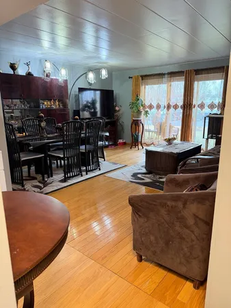 a room with table tennis pool table and windows