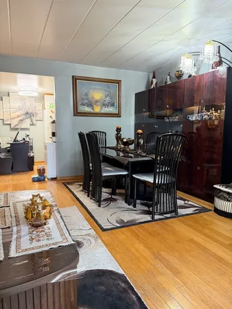 a living room with furniture a rug and a large window