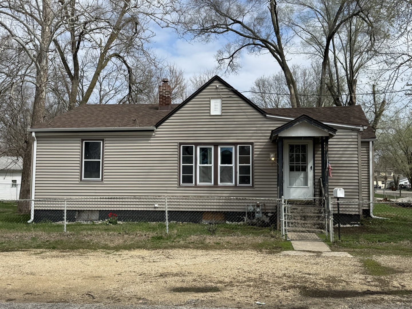 3245 9th Street Rockford, IL 61109 - Photo 1 of 26 a front view of a house with garden