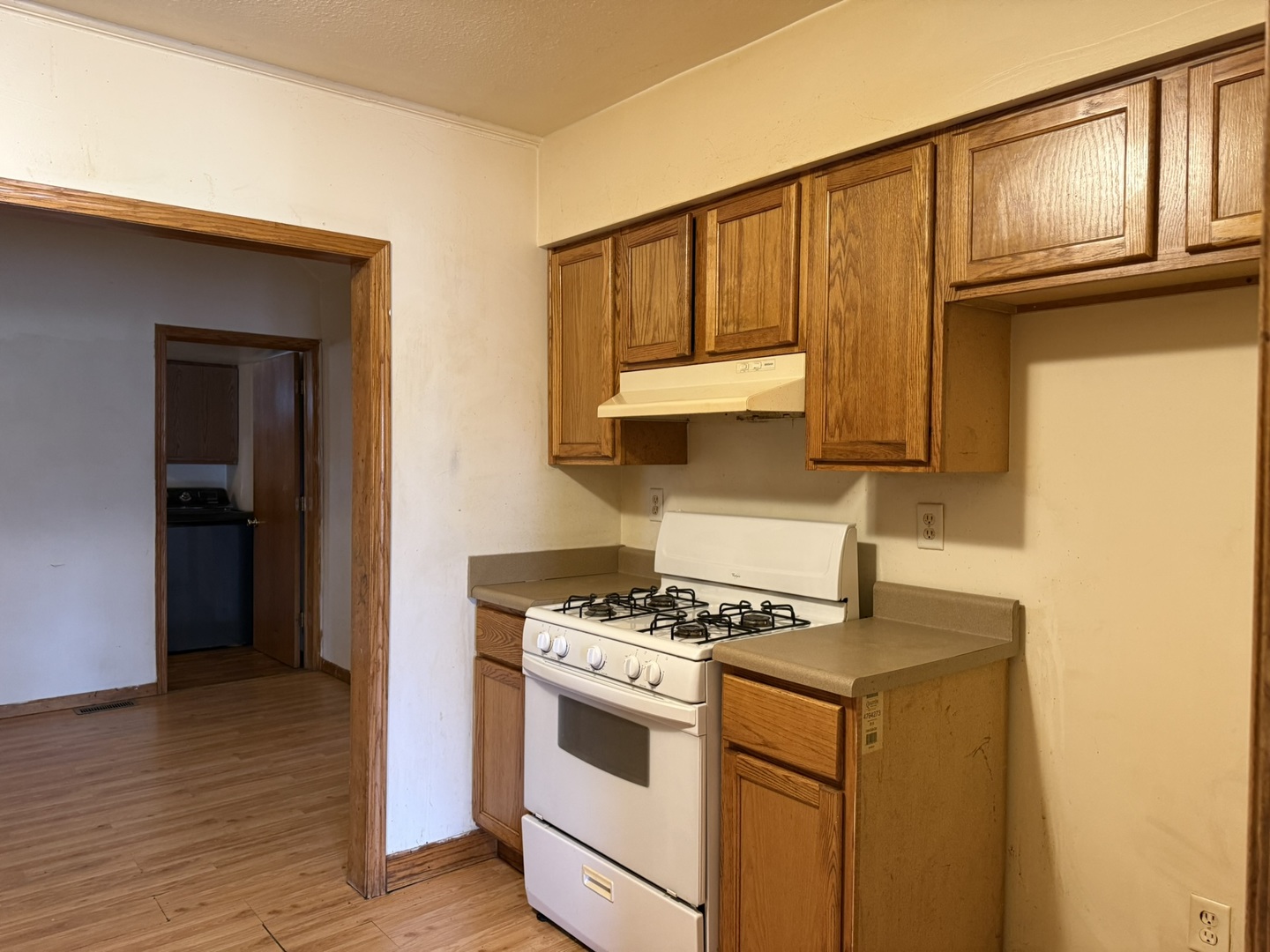 3245 9th Street Rockford, IL 61109 - Photo 16 of 26 a kitchen with stainless steel appliances granite countertop a stove a sink and a refrigerator