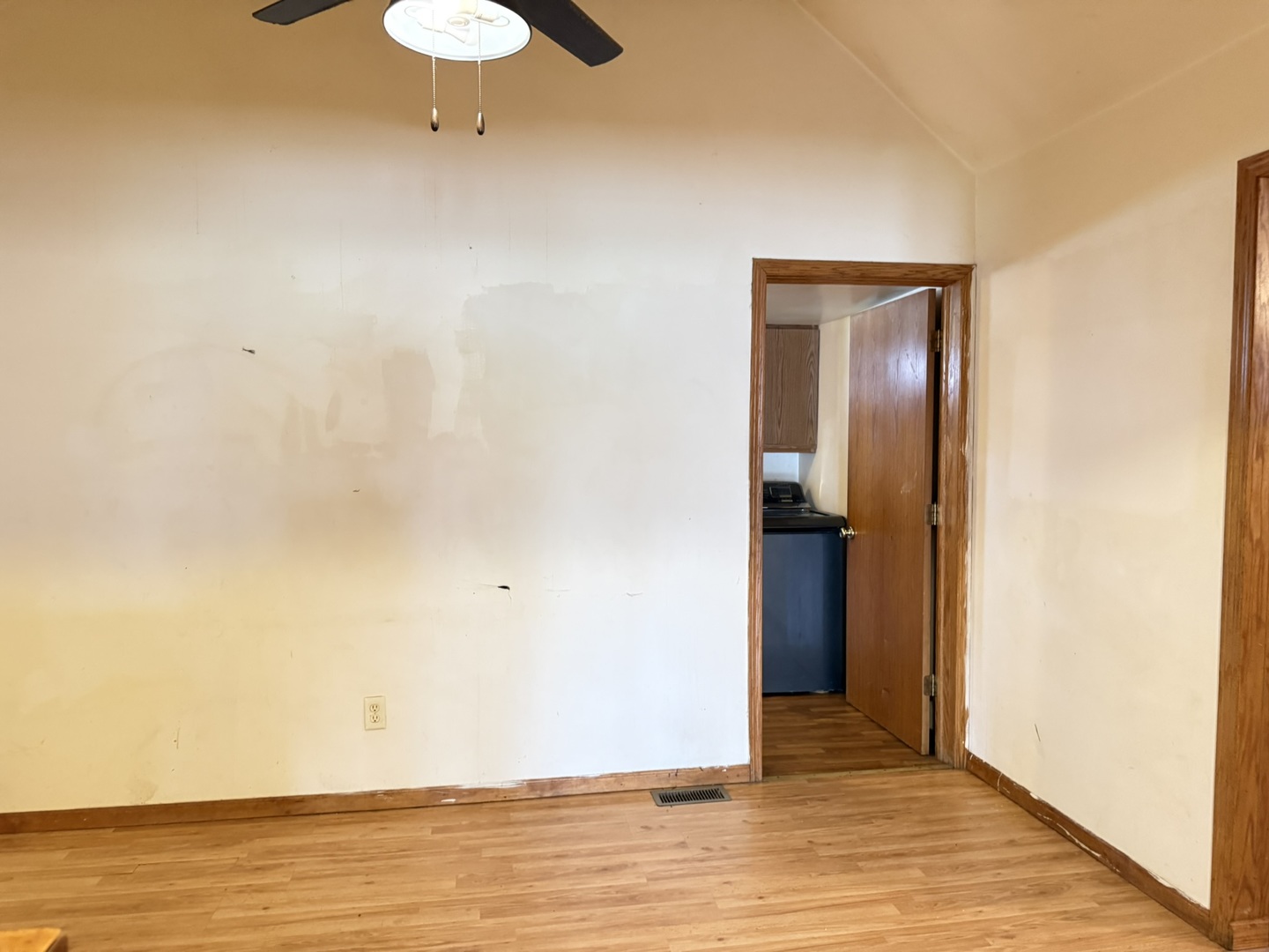 3245 9th Street Rockford, IL 61109 - Photo 17 of 26 a view of an empty room with wooden floor and a window
