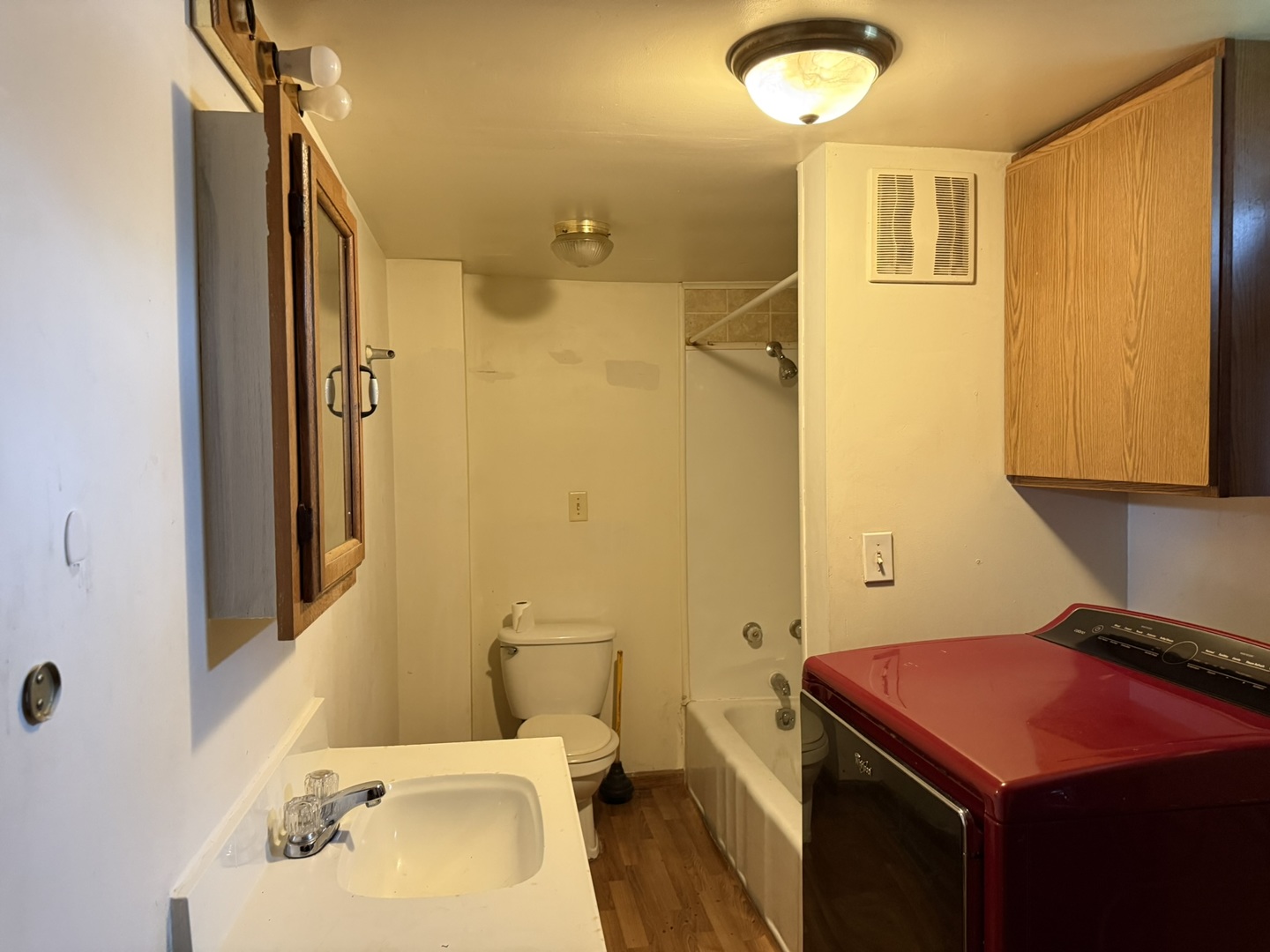 3245 9th Street Rockford, IL 61109 - Photo 18 of 26 a bathroom with a sink and a mirror