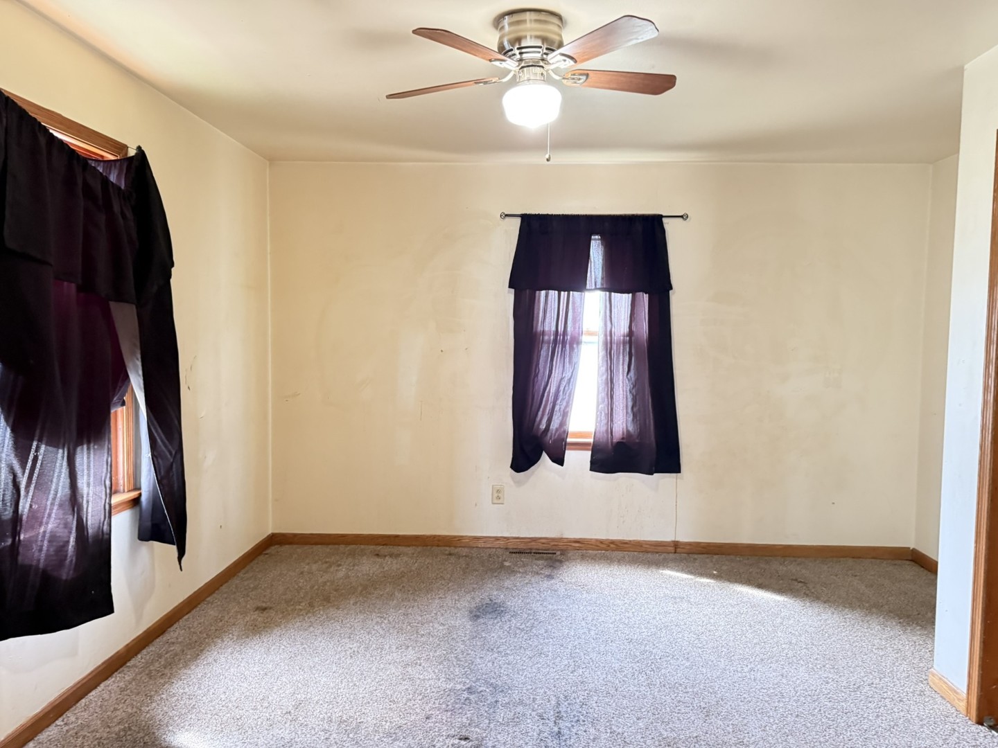 3245 9th Street Rockford, IL 61109 - Photo 20 of 26 an empty room with windows and fan chandelier